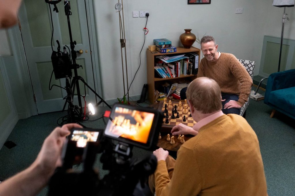 Charity Video Production with woven films playing chess for a campaign video